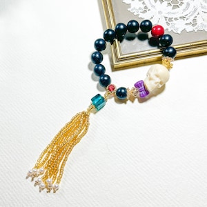 Stone Needle Bead / Craved Skull / Purple Mica / Phosphosiderite / Cinnabar / Extra Long Tessel / Charmed Energy Wishing Beaded Bracelet