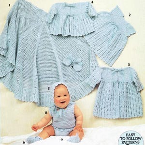 May include: A collection of light blue crocheted baby items, including a blanket, booties, a bonnet, a dress, a sweater, and a vest with matching diaper cover. The items are arranged around a smiling baby wearing a bonnet, vest, and diaper cover.