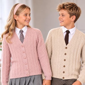 May include: A pink V-neck button-down cardigan with a textured vertical knit pattern and a beige V-neck button-down cardigan with a matching textured vertical knit pattern. Both garments feature long sleeves and are worn over white collared shirts.