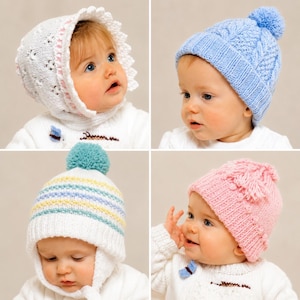 May include: A collection of four knitted hats for infants. One is a white bonnet with lace trim, one is a light blue cable-knit beanie with a pom-pom, one is a white beanie with pastel stripes and a teal pom-pom, and one is a pink beanie with a pom-pom.