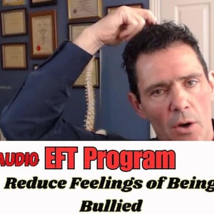 May include: A man in a blue shirt touches his head while looking at the camera. The image includes text that reads "AUDIO EFT Program" and "Reduce Feelings of Being Bullied" in a white and red banner.