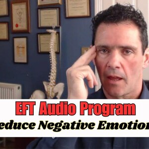 May include: A man in a blue shirt is talking to the camera. He is sitting in a chair in front of a wall with framed certificates. The text on the screen reads "EFT Audio Program Reduce Negative Emotions".