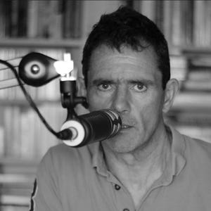 May include: A collage of four images featuring people speaking into microphones. The first image shows a person speaking into a microphone in a black and white setting. The second image shows a person speaking into a microphone in a black and white setting. The third image shows a person speaking into a microphone in a black and white setting. The fourth image shows a person speaking into a microphone in a black and white setting.