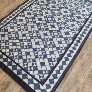 cotton wool rug, handwoven with a striking geometric design. Perfect for modern, coastal, or transitional interiors, this flatweave rug blends the softness of wool with the durability of cotton. Ideal for living rooms, bedrooms, or offices, it brings timeless style and comfort. Lightweight, reversible, and easy to maintain. Custom sizes available for designers and home decorators.