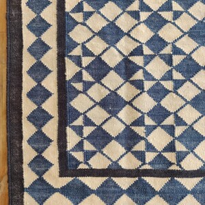 cotton wool rug, handwoven with a striking geometric design. Perfect for modern, coastal, or transitional interiors, this flatweave rug blends the softness of wool with the durability of cotton. Ideal for living rooms, bedrooms, or offices, it brings timeless style and comfort. Lightweight, reversible, and easy to maintain. Custom sizes available for designers and home decorators.