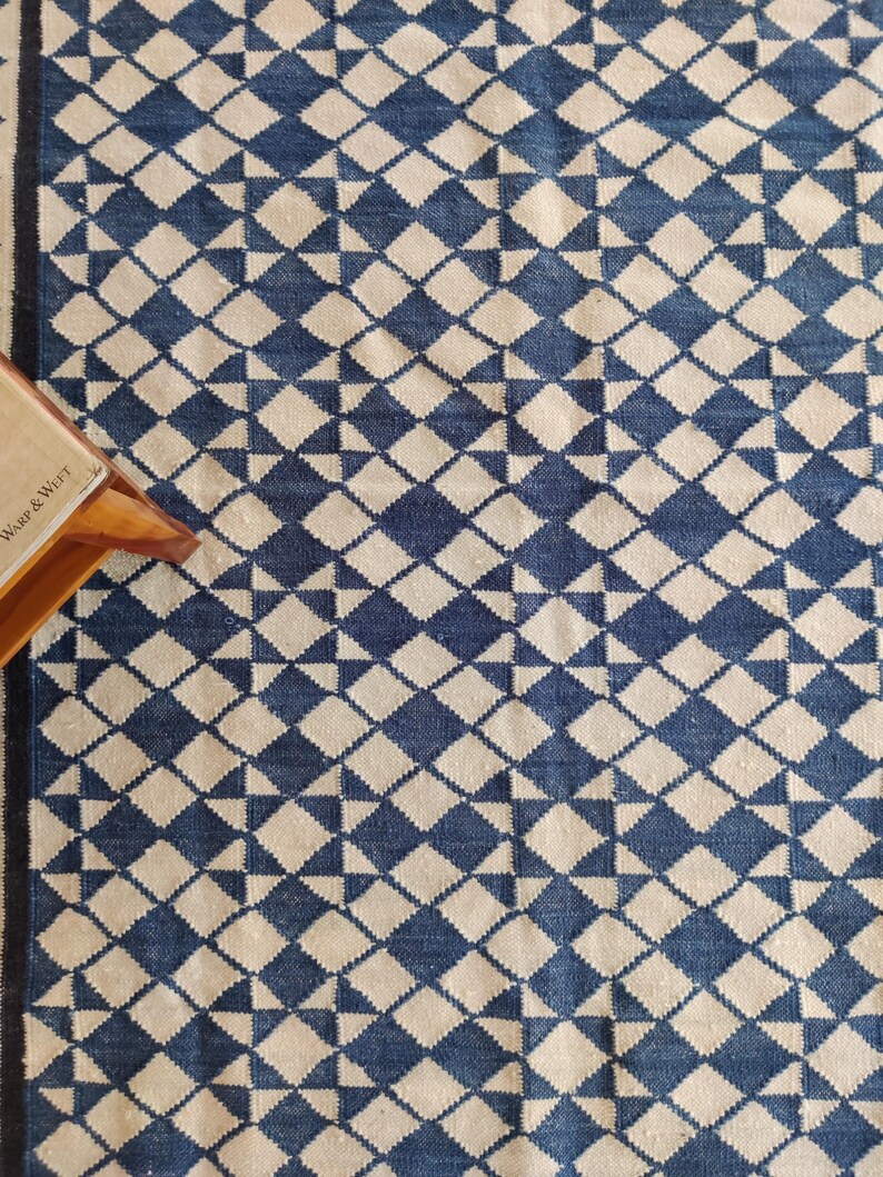cotton wool rug, handwoven with a striking geometric design. Perfect for modern, coastal, or transitional interiors, this flatweave rug blends the softness of wool with the durability of cotton. Ideal for living rooms, bedrooms, or offices, it brings timeless style and comfort. Lightweight, reversible, and easy to maintain. Custom sizes available for designers and home decorators.