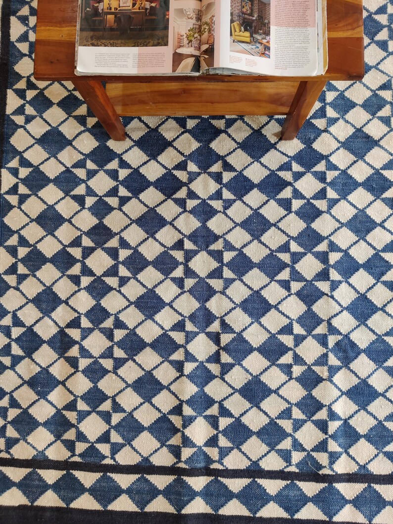 cotton wool rug, handwoven with a striking geometric design. Perfect for modern, coastal, or transitional interiors, this flatweave rug blends the softness of wool with the durability of cotton. Ideal for living rooms, bedrooms, or offices, it brings timeless style and comfort. Lightweight, reversible, and easy to maintain. Custom sizes available for designers and home decorators.