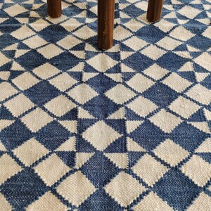 cotton wool rug, handwoven with a striking geometric design. Perfect for modern, coastal, or transitional interiors, this flatweave rug blends the softness of wool with the durability of cotton. Ideal for living rooms, bedrooms, or offices, it brings timeless style and comfort. Lightweight, reversible, and easy to maintain. Custom sizes available for designers and home decorators.