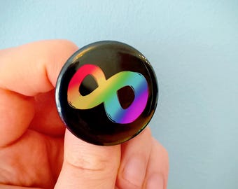 Rainbow Infinity Symbol, Neurodivergent Pride Badge on Black Background
