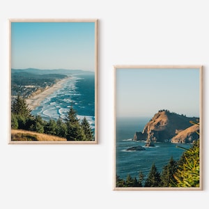 May include: Two framed photographs of coastal landscapes. The first image shows a long stretch of sandy beach with blue ocean waves crashing on the shore. The second image shows a rocky headland jutting out into the ocean with green trees in the foreground.