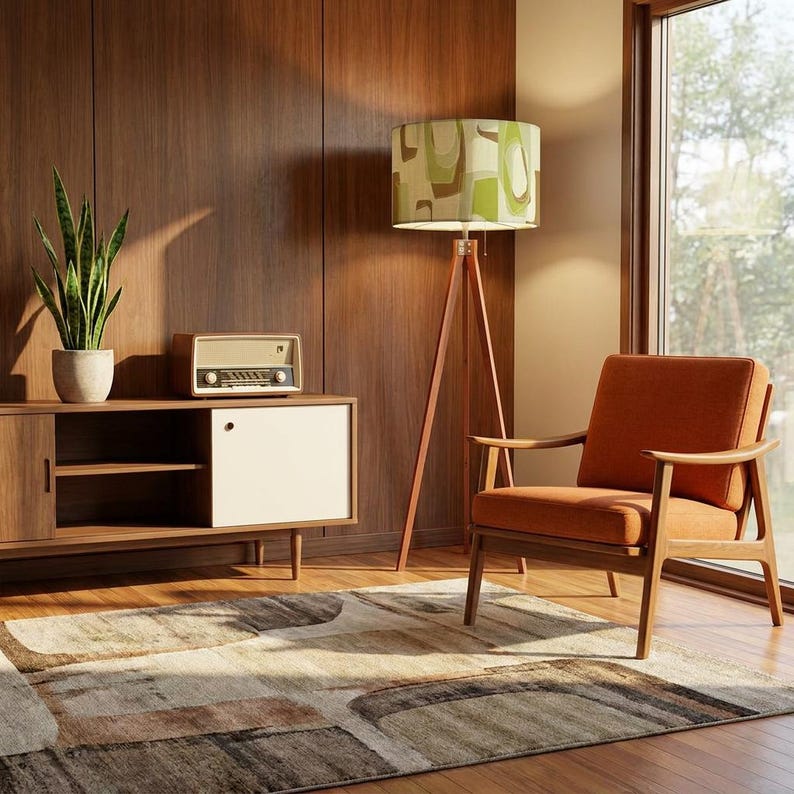 Atomic style tripod floor lamp with retro drum lampshade for modern vintage interiors.