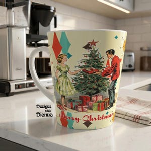 May include: Cream-colored ceramic mug with a retro Christmas design. The mug features a couple exchanging gifts near a decorated Christmas tree. The words "Merry Christmas" are printed on the mug, along with the text "Designs with Dianna".