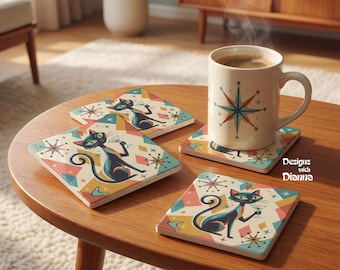 May include: Three square coasters and one ceramic mug featuring a black cat holding a martini glass, surrounded by colorful geometric shapes and starburst patterns. The mug displays a large starburst design and the text Designs with Dianna.