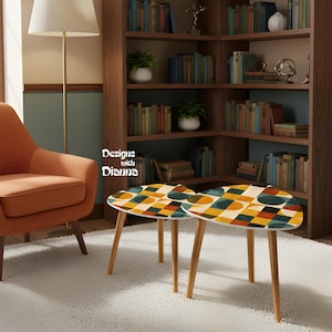 May include: Two small, mid-century modern style coffee tables with a colorful geometric pattern on the tabletop. The tables have light wood legs and are set in a living room with an orange armchair and a bookshelf. The text "Designs with Dianna" is visible.