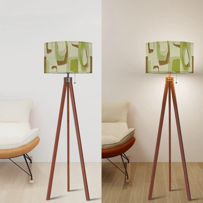 Modern tripod floor lamp with Mid Century geometric drum lampshade in earthy olive green colors.
