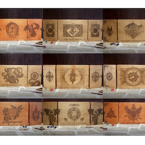May include: Three wooden panels with a brown leather finish. Each panel features a different design, including a dragon, a creature with tentacles, and a compass. The panels are labeled with the text "The Dice Decide", "You May Certainly Try", and "Dungeon Master".
