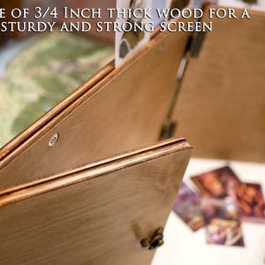May include: Close-up of a wooden game screen made of 3/4 inch thick wood. The screen is folded and has a hinge. The text "MADE OF 3/4 INCH THICK WOOD FOR A STURDY AND STRONG SCREEN" is visible on the screen.