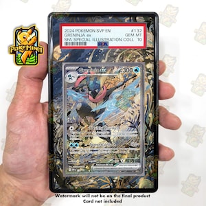 May include: A PSA graded 2024 Pokemon SVP EN #132 Greninja ex trading card in a protective plastic slab. The card features a blue and black Greninja character with pink accents, 300 HP, and the text Stealthy Shuriken and Torrential Slash.