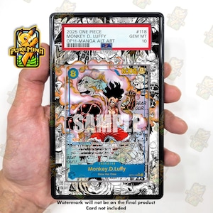 May include: A graded 2025 One Piece Monkey D. Luffy trading card in a black PSA slab. The card features manga-style black and white artwork with a central colour illustration of Luffy. The label reads 2025 ONE PIECE MONKEY D. LUFFY OP11-MANGA ALT ART.