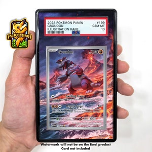 May include: A Pokemon trading card featuring Groudon, a red and grey Pokemon with a fiery background. The card is a 2023 Pokemon PAR EN Groudon Illustration Rare card with a Gem Mint 10 rating. The card has a basic energy card, swelling power, and magma purge attacks.