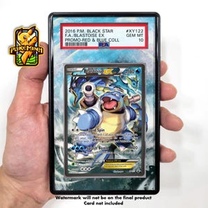 May include: A Pokémon trading card featuring Blastoise EX, graded GEM MT 10. The card is in a protective case with text including "2016 P.M. BLACK STAR" and "PROMO-RED & BLUE COLL". The Blastoise illustration is blue and white.
