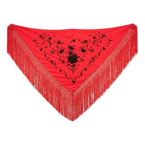 May include: A triangular red shawl featuring black floral embroidery across the center. The edges of the shawl are finished with long, thin red fringe that hangs down from the two angled sides, creating a decorative border around the fabric.