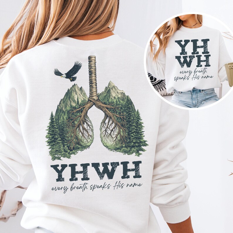 May include: White sweatshirt with a graphic of a pair of lungs made of trees and mountains. The text "YHWH every breath speaks His name" is printed below the graphic.