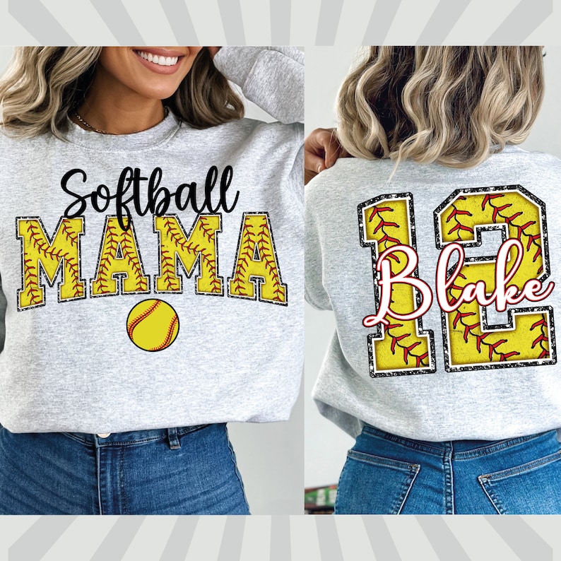 May include: Two gray sweatshirts with a softball theme. One sweatshirt has the text "Softball Mama" with a baseball graphic. The other sweatshirt has a large number "12" with the name "Blake" inside the number. Both sweatshirts have a glittery, baseball-stitched design.