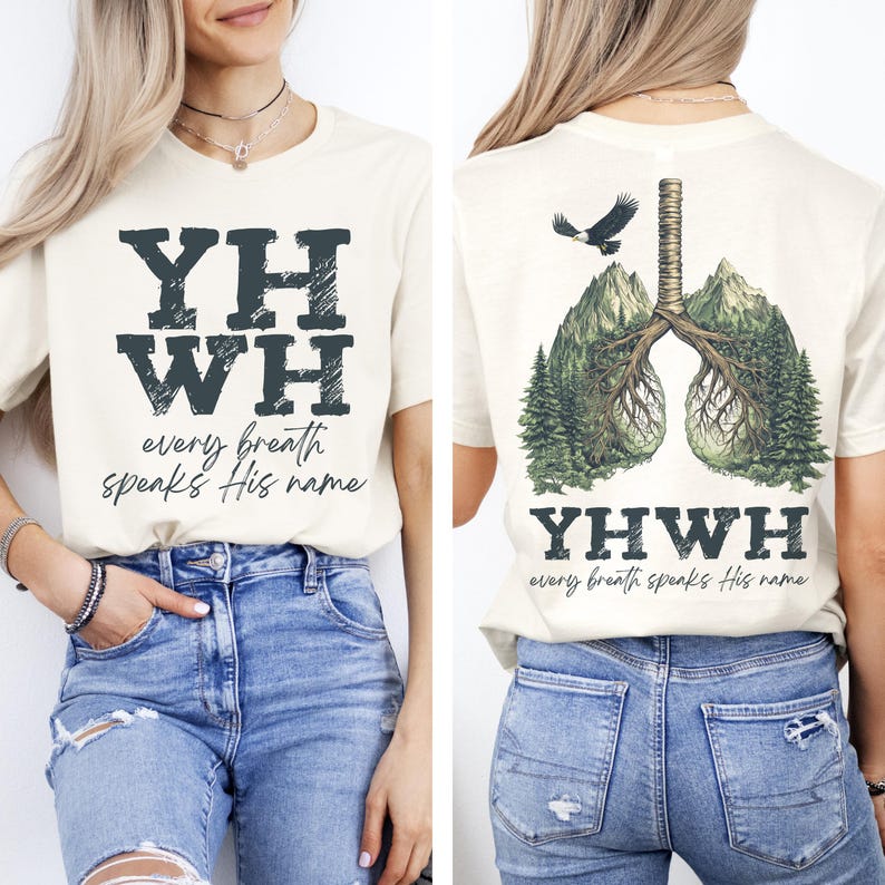 May include: A cream colored t-shirt with the words "YHWY every breath speaks His name" printed on the front. The back of the shirt features a graphic of a pair of lungs with trees growing out of them. The text "YHWY every breath speaks His name" is printed below the graphic.
