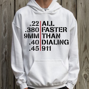 May include: White hooded sweatshirt with black text that reads '.22 ALL FASTER THAN .40 DIALING .45 911' with a red vertical line separating the text.