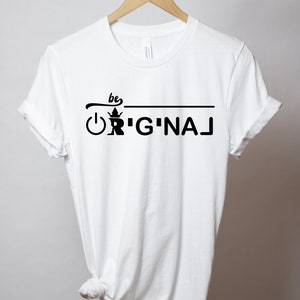 May include: White t-shirt with black text that reads "be ORIGINAL" with a crown and an on/off switch graphic.