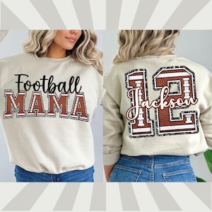 May include: A beige sweatshirt with the text "Football Mama" on the front and a brown football jersey with the number "12" and the name "Jackson" on the back.
