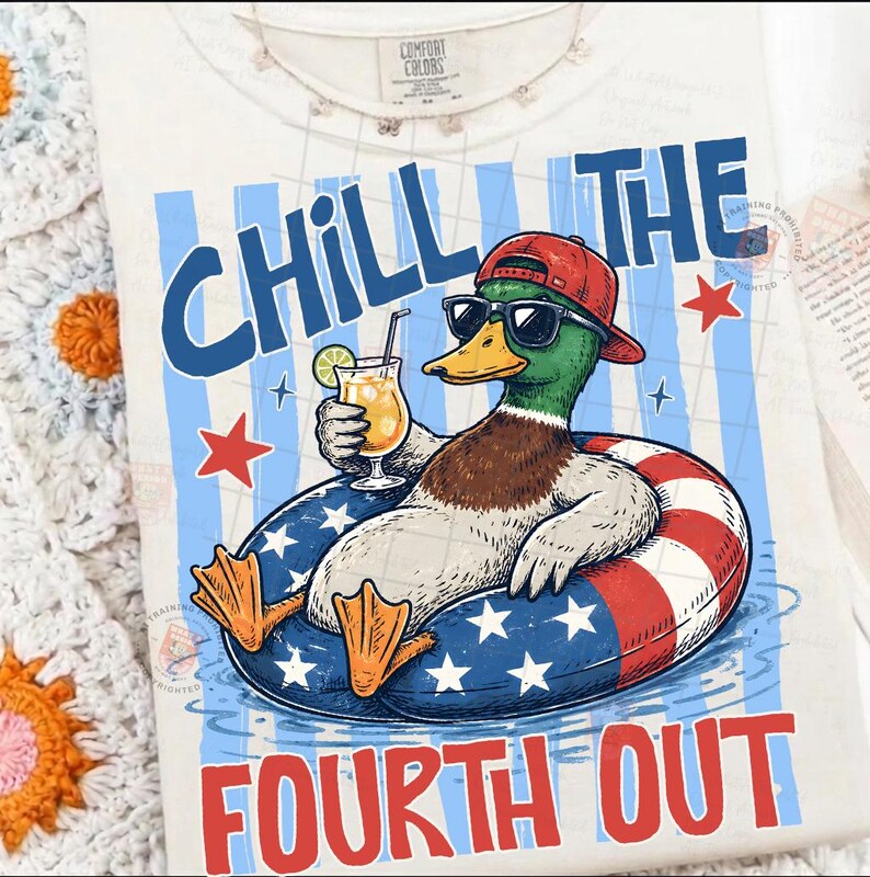 May include: Cream-colored t-shirt with a graphic of a duck wearing sunglasses and a red cap, floating in a patriotic inner tube. The text "CHILL THE FOURTH OUT" is printed in blue and red.