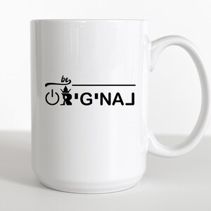 May include: White ceramic mug with a black design that says "be original" with a crown and power button graphic.