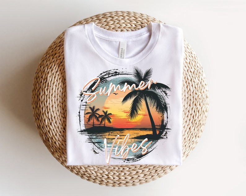 May include: White t-shirt with a graphic design of a sunset with palm trees and the text "Summer Vibes" in a distressed font.