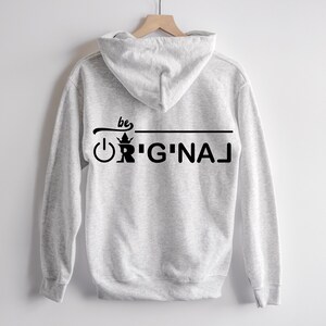 May include: Gray hooded sweatshirt with a black graphic on the back that says "be original" with a crown and power button symbol.