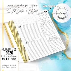 May include: A spiral-bound planner with a gold coil and a gold pen. The planner is open to a page with the days of the week, and has a small calendar. The text on the planner reads "MODELO M22 2026".