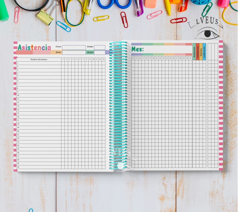 May include: A spiral-bound attendance tracker notebook with the word "Asistencia" in pink and a grid for recording student attendance. The notebook has a teal spiral binding and colorful accents.