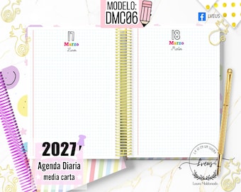 May include: An open 2027 daily planner with a gold spiral binding, featuring grid-lined pages dated March 17 and 18. The planner includes text reading 'MODELO: DMC06', '2027', 'Agenda Diaria media carta', and a logo with 'Lveus' and 'Laura Maldonado'.