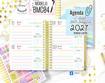 May include: A 2027 spiral-bound planner with a pastel-colored interior layout featuring two days per page. The pages include sections for daily tasks, income, expenses, and hydration tracking. A gold pen and decorative stickers are visible.