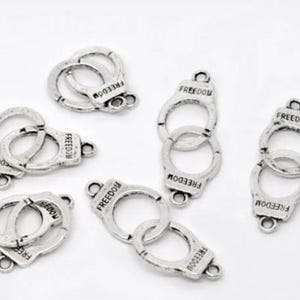 Set of 3 handcuff connector charms 42x15 mm in Tibetan silver