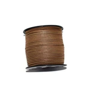 May include: A spool of brown leather cord, wound around a black plastic bobbin.