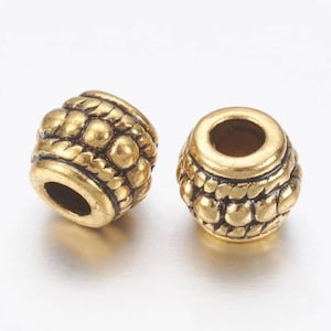 金メッキチベットシルバーのバレルスペーサービーズ 8x6.5 mm 20 個ロット