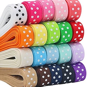 May include: A selection of colourful polka dot ribbons in shades of pink, red, green, blue, and purple. The ribbons are rolled and stacked, displaying a range of colours and patterns. Ideal for crafting and gift wrapping, these ribbons offer a playful touch.