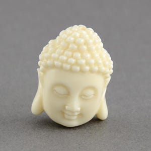 Set of 10 synthetic coral Buddha head beads 15x10 mm