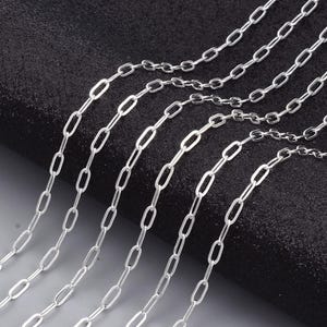 Silver-plated brass trombone chain 7.6x2.6 mm sold by the meter