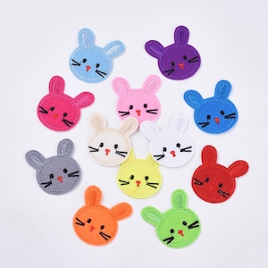 Peut inclure: Assortiment de 12 patchs brodés de lapin en forme de lapin à repasser. Les patchs sont de différentes couleurs, notamment rose, bleu, vert, jaune, rouge, blanc et violet.