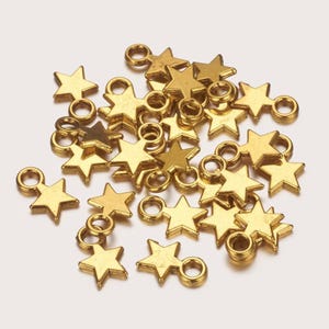 set of 10 star charm pendants 10x8x2 mm