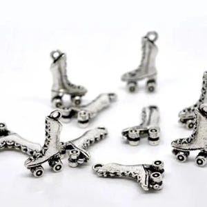 May include: A set of ten silver-toned roller skate charms. Each charm features a detailed design of a roller skate with four wheels.