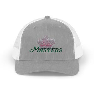 Cappellino da camionista Augusta con chiusura a scatto e retro in rete e motivo floreale.